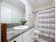 Bright bathroom with a white vanity and a shower/tub combo at 32573 Turtle Grace Loop, Wesley Chapel, FL 33545