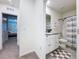 Well-maintained bathroom with white vanity, tile flooring, and shower-tub combination at 32573 Turtle Grace Loop, Wesley Chapel, FL 33545