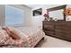 Bedroom featuring furniture, a television, and a window at 32573 Turtle Grace Loop, Wesley Chapel, FL 33545