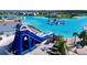 A community pool offers a blue waterslide and a playground at the Epperson Lagoon in Wesley Chapel, Florida at 32573 Turtle Grace Loop, Wesley Chapel, FL 33545