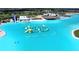 A community pool with recreational water structures for summer fun at the Epperson Lagoon in Wesley Chapel, Florida at 32573 Turtle Grace Loop, Wesley Chapel, FL 33545