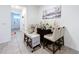Dining area decorated with seasonal decor and lots of natural light, tile floor at 32573 Turtle Grace Loop, Wesley Chapel, FL 33545