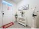 Entrance hall features decorated walls, tile flooring and decor at 32573 Turtle Grace Loop, Wesley Chapel, FL 33545