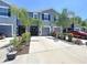 Attractive townhome with well-maintained landscaping, driveway, and charming curb appeal at 32573 Turtle Grace Loop, Wesley Chapel, FL 33545