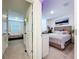 Hallway leading to a bedroom with neutral walls and carpeted floors at 32573 Turtle Grace Loop, Wesley Chapel, FL 33545