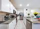 Well-equipped kitchen with granite countertops, stainless steel appliances, and a functional layout at 32573 Turtle Grace Loop, Wesley Chapel, FL 33545