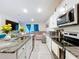 Modern kitchen with granite countertops, stainless steel appliances, and an open layout at 32573 Turtle Grace Loop, Wesley Chapel, FL 33545