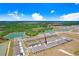 New townhomes with assigned parking, located conveniently near ponds, lush green trees, and a parkway at 32978 Tulip Petal Ln, Wesley Chapel, FL 33545