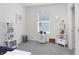 This bedroom features neutral carpet and light walls that make the area relaxing and calming at 32978 Tulip Petal Ln, Wesley Chapel, FL 33545