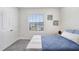 Bedroom with closet and view outside the window at 32978 Tulip Petal Ln, Wesley Chapel, FL 33545