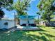 Backyard space with a deck, furniture, and ample green space for outdoor activities at 3498 13Th S Ave, St Petersburg, FL 33711