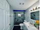 Modern bathroom featuring marble tiled shower, sleek fixtures, and contemporary vanity at 3498 13Th S Ave, St Petersburg, FL 33711