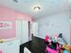 Cheerful bedroom decorated with pink accents and star decals, perfect for a  at 3498 13Th S Ave, St Petersburg, FL 33711