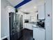 Modern kitchen featuring stainless steel appliances, granite counters, and white cabinetry at 3498 13Th S Ave, St Petersburg, FL 33711
