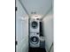 The laundry room features a stacked washer and dryer, and modern white cabinets at 3498 13Th S Ave, St Petersburg, FL 33711