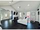 Bright living room with high vaulted ceilings, modern lighting, and dark wood floors at 3498 13Th S Ave, St Petersburg, FL 33711