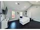 Spacious living room with vaulted ceilings, natural light, and dark wood floors at 3498 13Th S Ave, St Petersburg, FL 33711