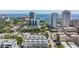 A vibrant cityscape features luxurious condos with balconies and stunning water views against a sunny, blue sky at 409 Regent N Ln, St Petersburg, FL 33701