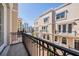 Charming balcony overlooking a brick courtyard, with views of downtown buildings in the distance at 409 Regent N Ln, St Petersburg, FL 33701