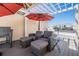 Outdoor balcony with cozy seating beneath a stylish pergola, offering shade and city views at 409 Regent N Ln, St Petersburg, FL 33701