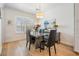 Contemporary dining room with hardwood floors, modern lighting, and ample natural light at 409 Regent N Ln, St Petersburg, FL 33701