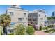 Modern condo building with balconies and lush landscaping, situated in a vibrant city location at 409 Regent N Ln, St Petersburg, FL 33701