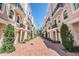 Elegant townhomes feature brick paved entryway and manicured landscaping within a gated community at 409 Regent N Ln, St Petersburg, FL 33701