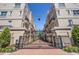 Elegant townhomes feature brick paved entryway and manicured landscaping within a gated community at 409 Regent N Ln, St Petersburg, FL 33701