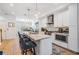 Bright kitchen features an island with seating, modern appliances, and ample cabinet space at 409 Regent N Ln, St Petersburg, FL 33701