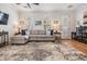Comfortable living room with hardwood floors, shuttered windows, and stylish furnishings at 409 Regent N Ln, St Petersburg, FL 33701