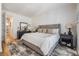 Serene main bedroom with a comfortable bed, neutral decor, and hardwood floors at 409 Regent N Ln, St Petersburg, FL 33701