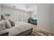 Bright main bedroom featuring french doors to the outside, and a cozy sitting area with a comfy loveseat at 409 Regent N Ln, St Petersburg, FL 33701
