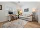 Bright office space features a cozy sofa, hardwood floors, a built-in desk and plenty of light at 409 Regent N Ln, St Petersburg, FL 33701