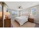 Comfortable bedroom with plush bedding, soft natural light, and a ceiling fan at 4108 Mellon Dr, Odessa, FL 33556
