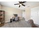 Office/bedroom featuring a desk, comfortable office chair, and ceiling fan at 4108 Mellon Dr, Odessa, FL 33556