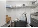 Closet with wire shelving and a variety of storage bins and boxes at 4108 Mellon Dr, Odessa, FL 33556