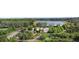 Aerial shot of a community garden near a lake and recreational area, promoting outdoor living at 4108 Mellon Dr, Odessa, FL 33556