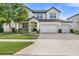 Charming two-story home featuring a three car garage, landscaped yard and inviting curb appeal at 4108 Mellon Dr, Odessa, FL 33556