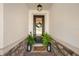 Inviting front entryway with stone accents, a welcoming wreath, and stylish decor at 4108 Mellon Dr, Odessa, FL 33556