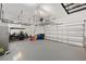 Spacious garage with golf cart, shelving and epoxy floors at 4108 Mellon Dr, Odessa, FL 33556