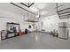 Spacious garage with shelving, hanging racks and epoxy floors at 4108 Mellon Dr, Odessa, FL 33556