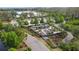 Aerial view of a community garden featuring a windmill and various garden plots at 4108 Mellon Dr, Odessa, FL 33556