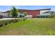 Exterior shot of Starkey Ranch Theatre Library, highlighting architecture and green space at 4108 Mellon Dr, Odessa, FL 33556