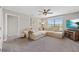 Cozy living area with a large sectional couch, ceiling fan, and lots of natural light at 4108 Mellon Dr, Odessa, FL 33556