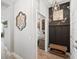 Mudroom with coat rack and bench, located off the hallway, provides storage and organization at 4108 Mellon Dr, Odessa, FL 33556
