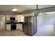 Modern kitchen featuring stainless steel appliances and white cabinetry at 4301 15Th N Ave, St Petersburg, FL 33713