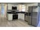 Modern kitchen featuring stainless steel appliances and white cabinetry at 4301 15Th N Ave, St Petersburg, FL 33713