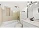 Modern bathroom featuring neutral tile, updated fixtures, and a glass shower door at 4675 26Th N Ave, St Petersburg, FL 33713