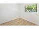 Bright bedroom featuring hardwood floors and a window letting in natural light at 4675 26Th N Ave, St Petersburg, FL 33713