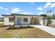 Charming single-story home with a modern design, fresh landscaping, and a covered carport at 4675 26Th N Ave, St Petersburg, FL 33713